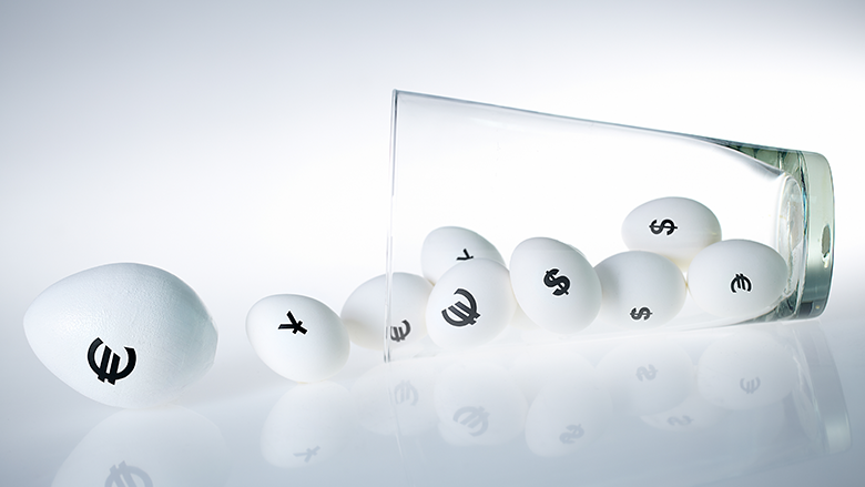 currency logos on balls inside tipped cup